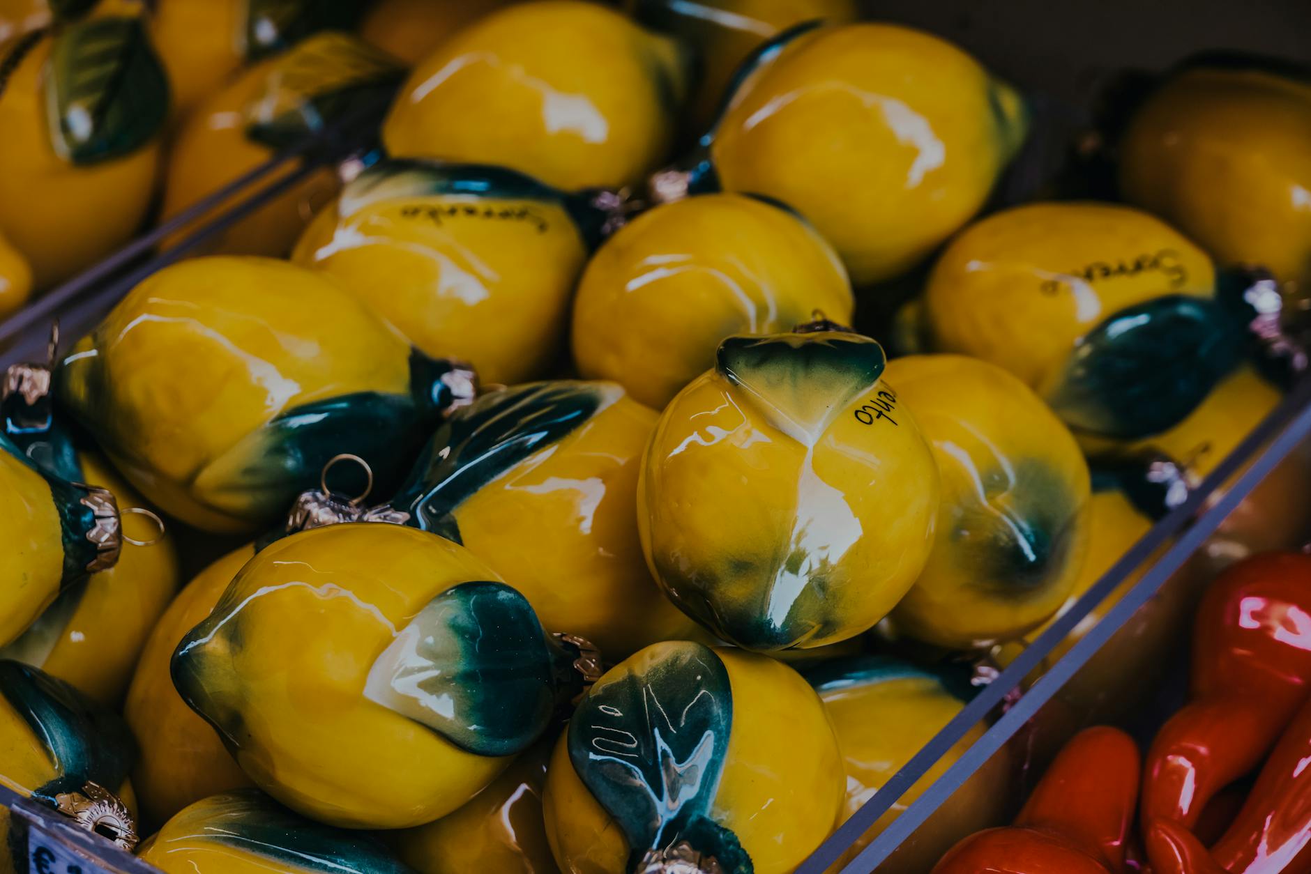 Vibrant yellow ceramic lemons artfully displayed, symbolizing freshness and renewal